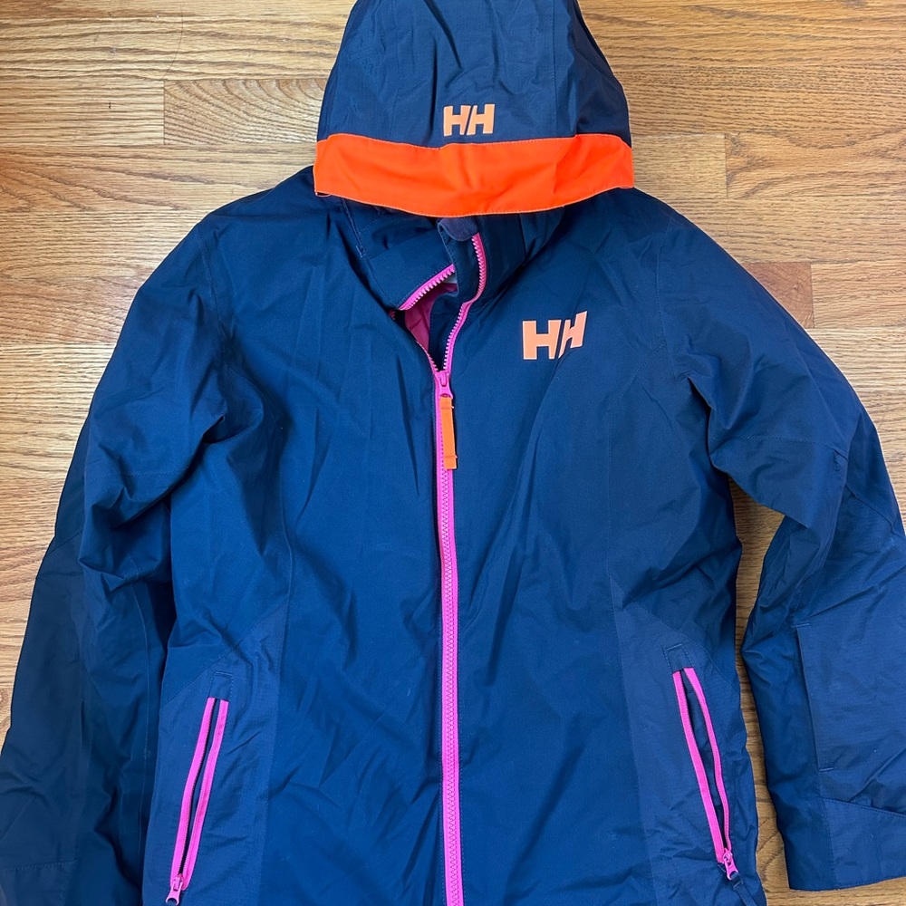 Girls Helly Hanson Ski Jacket - Navy outer, pink lining.